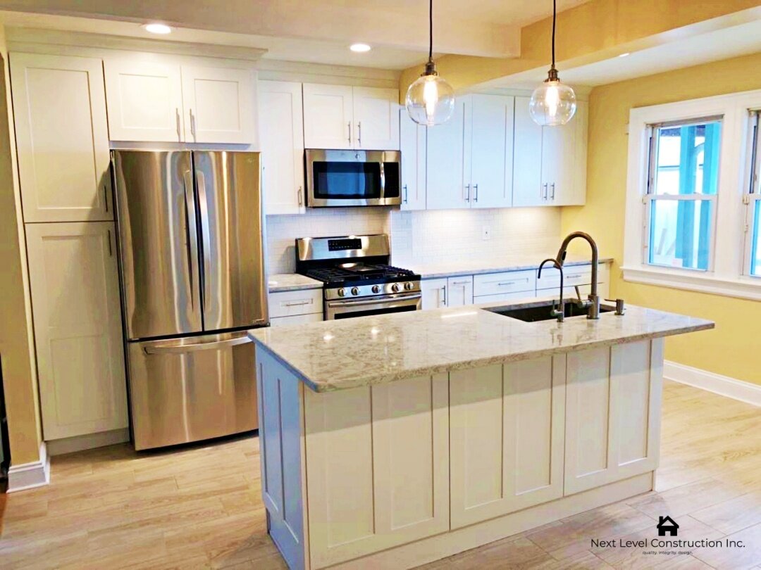 kitchen white shaker cabinets island with seating_Queens house.jpg