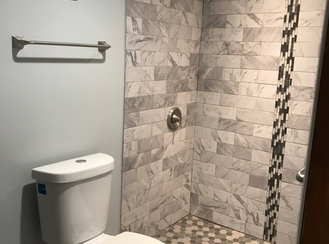Bathroom gray tile with strip accent mosaic_queens house.jpg