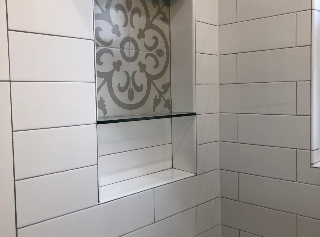 Bathroom white subway tile and accent niche_queens apartment.jpg