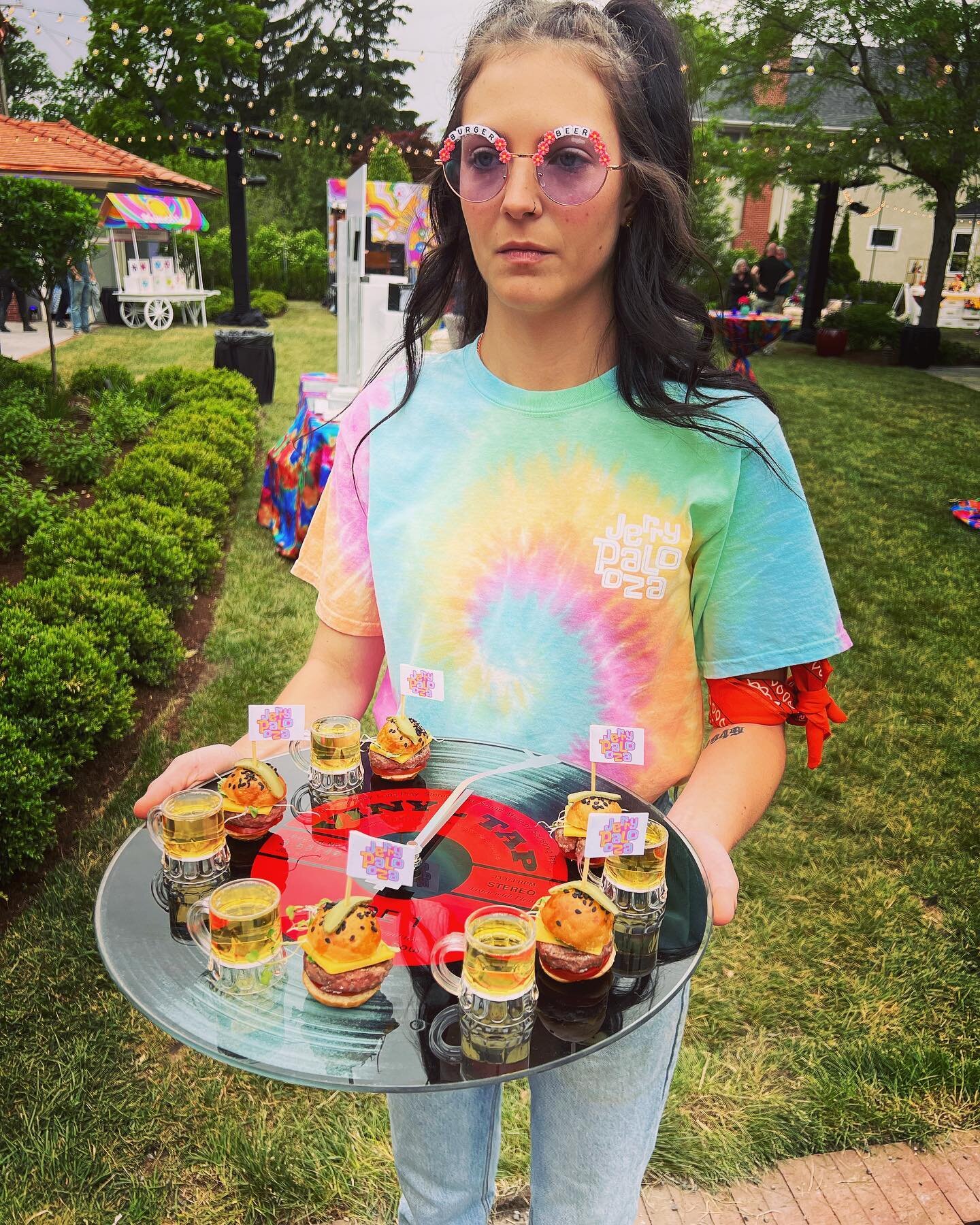 Staff uniforms change with each event.  From black tie to tie dye, this should ALWAYS match your event/theme.  For this LOLLA themed event, custom tees, temporary tattoos, and custom sunglasses - that list what the server is SERVING (!) - were all cr