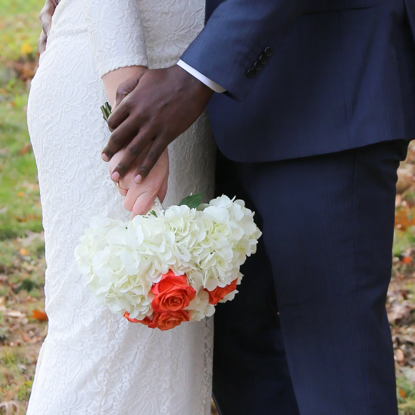 bride and groom holding hands 