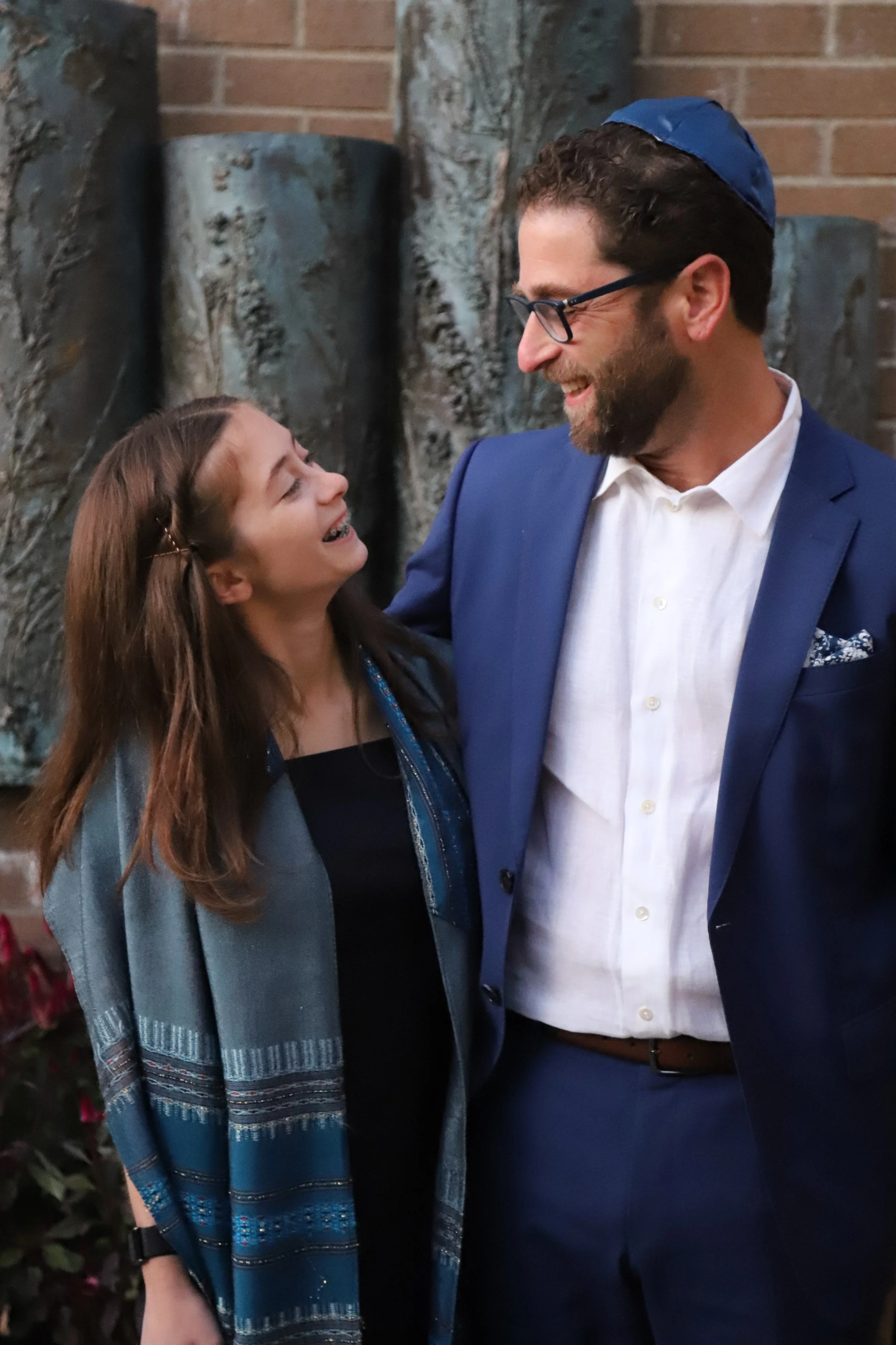 father and daughter looking at each other bat mitzvah kensington 