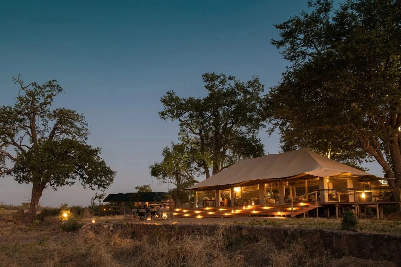 machaba-zimbabwe-deteema-camp-main-tent-evening-candle-lit.jpg