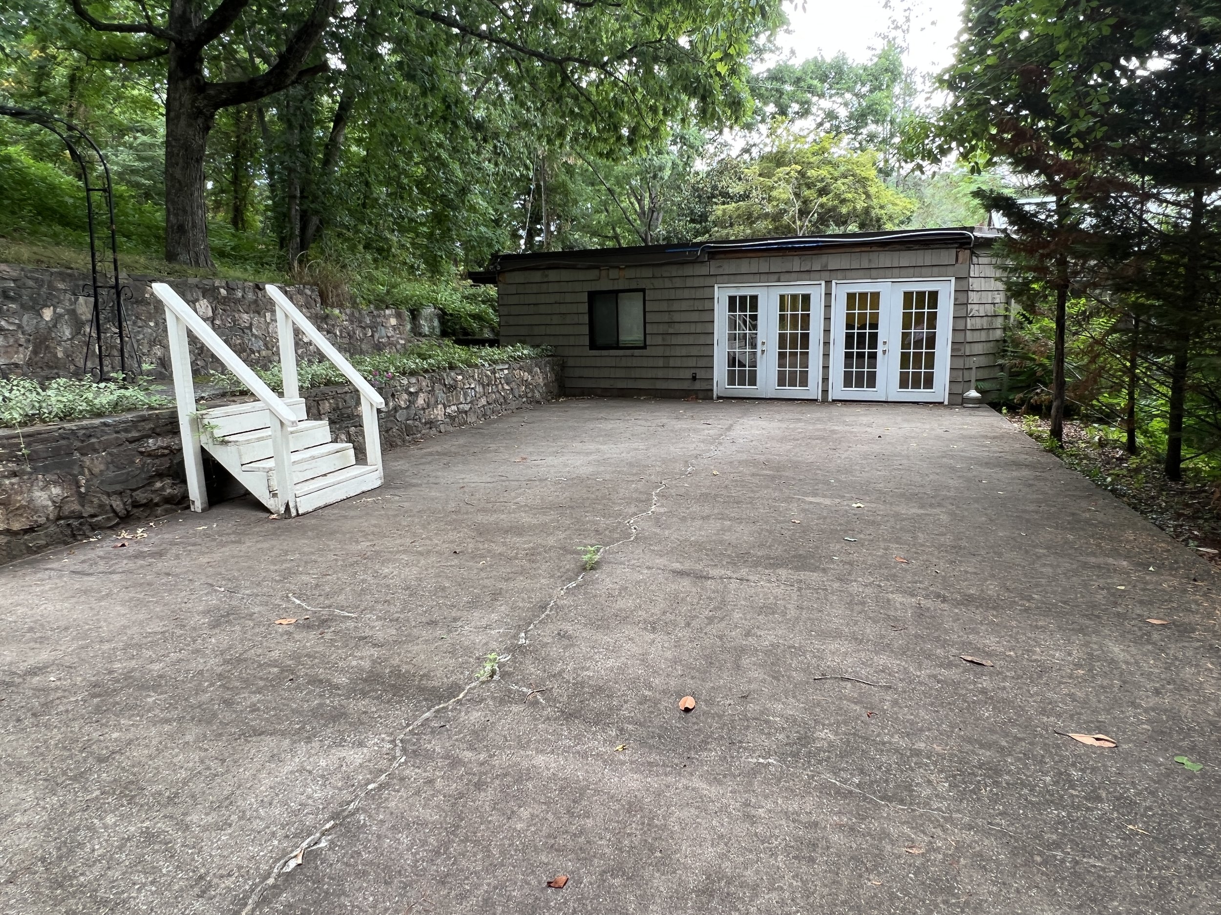 Outdoor attached back patio view from end toward building