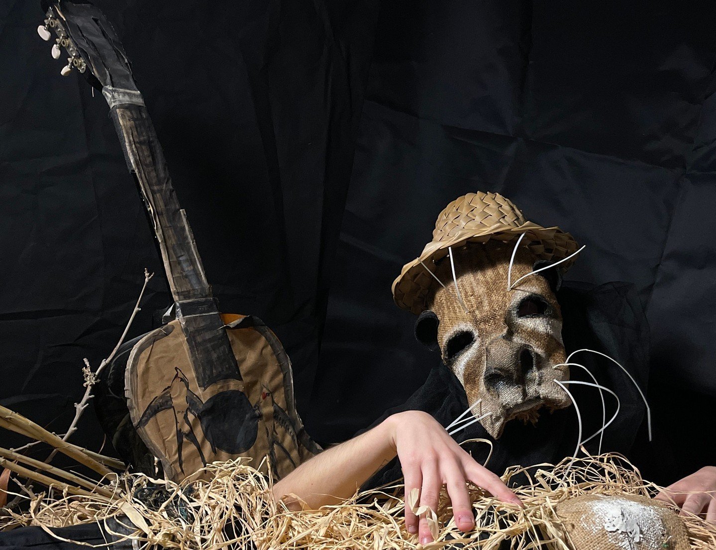 An otter strums a guitar, creating a melodious tune in the comfort of its nest. The playful creature's nimble paws effortlessly dance across the strings, producing a delightful melody that resonates through the air. The otter's natural talent for mus