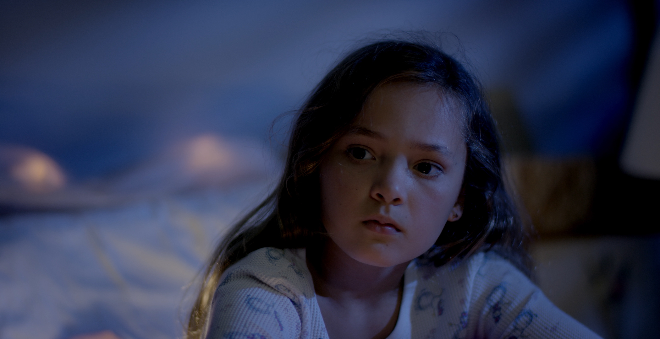 Casey Lopez as the young girl, Sam.