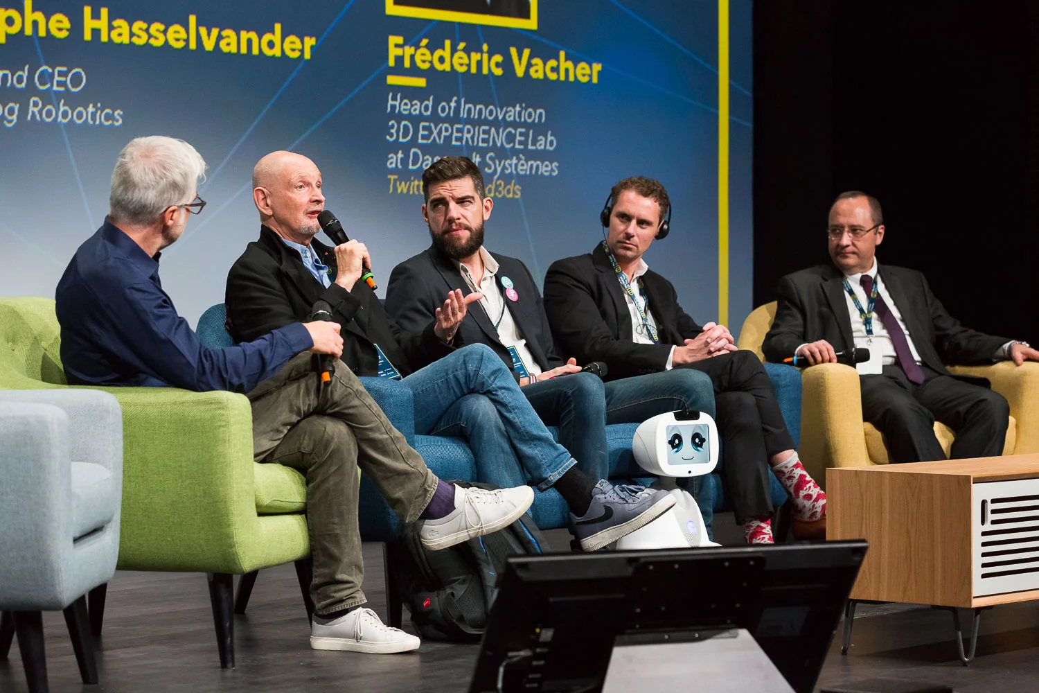 AI & Robots serving healthcare. Frédéric Vacher - Head of Innovation 3D EXPERIENCE Lab at Dassault Systèmes, Serge Tisseron - Psychiatrist, member of the Academy of Technology, Founding President of "Institute for the study of relations between humans and robots" (IERHR), Rodolphe Hasselvander - Founder and CEO of Blue Frog Robotics, Jesse Arlen Smith - Founder of AI for Good, Founder of JohnnyFive AI, Pr. Luc Soler – Founder at Visible Patient, Francis Bach - Researcher at INRIA