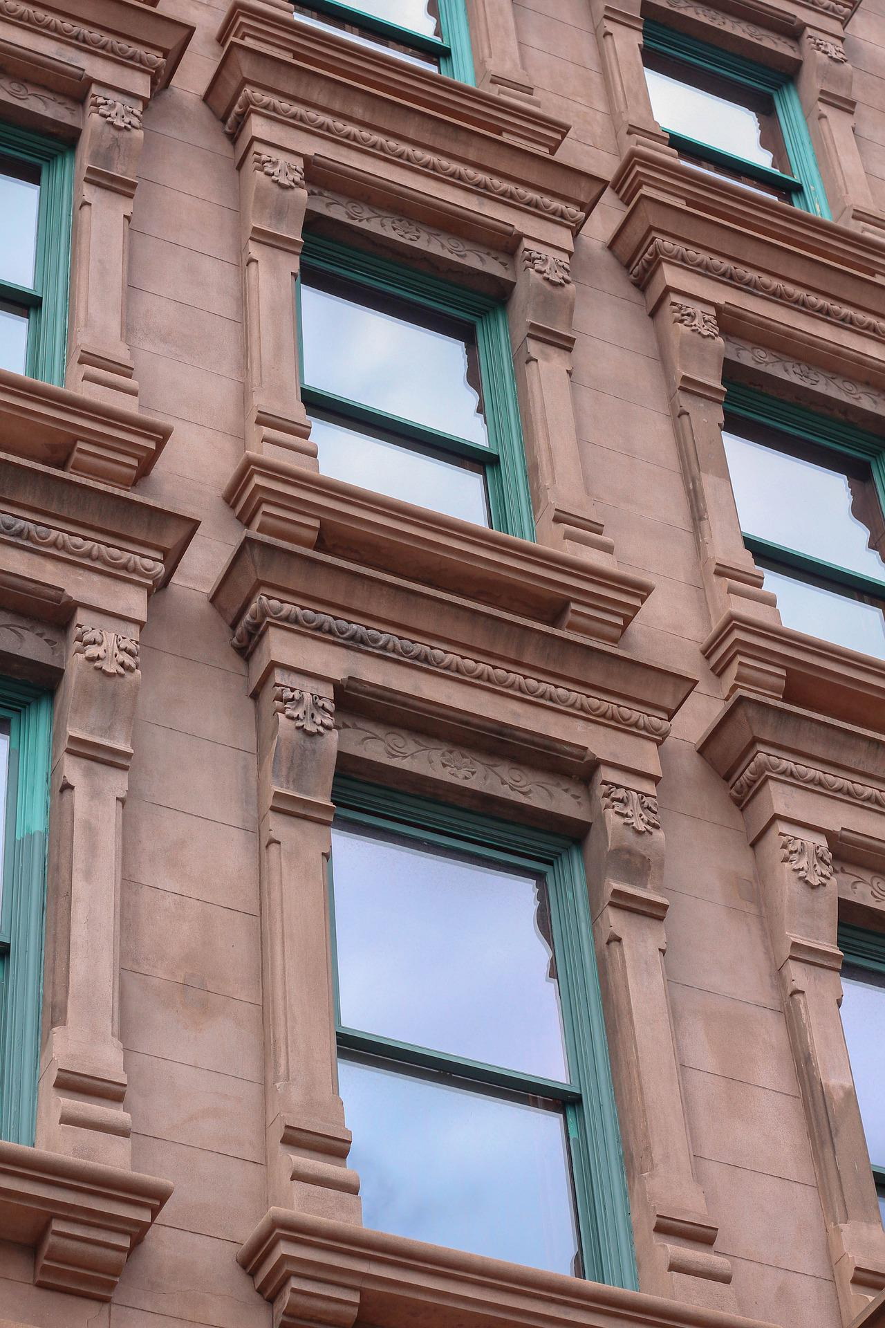 A brownstone building with windows