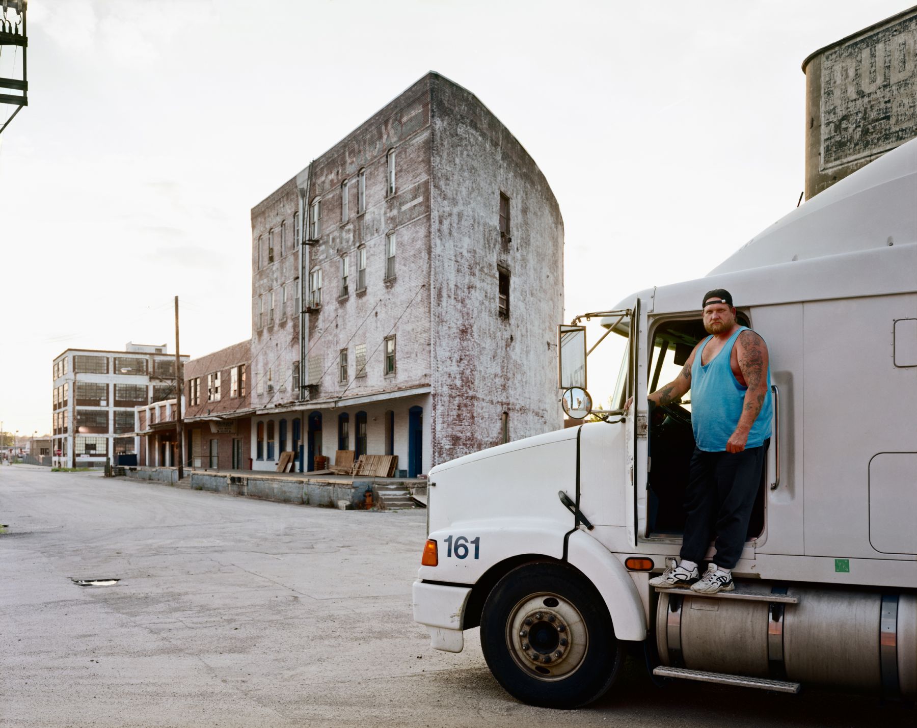 A Man Stepping into the Cab of His Truck, The Bottoms, Kansas City, Missouri, June 1998