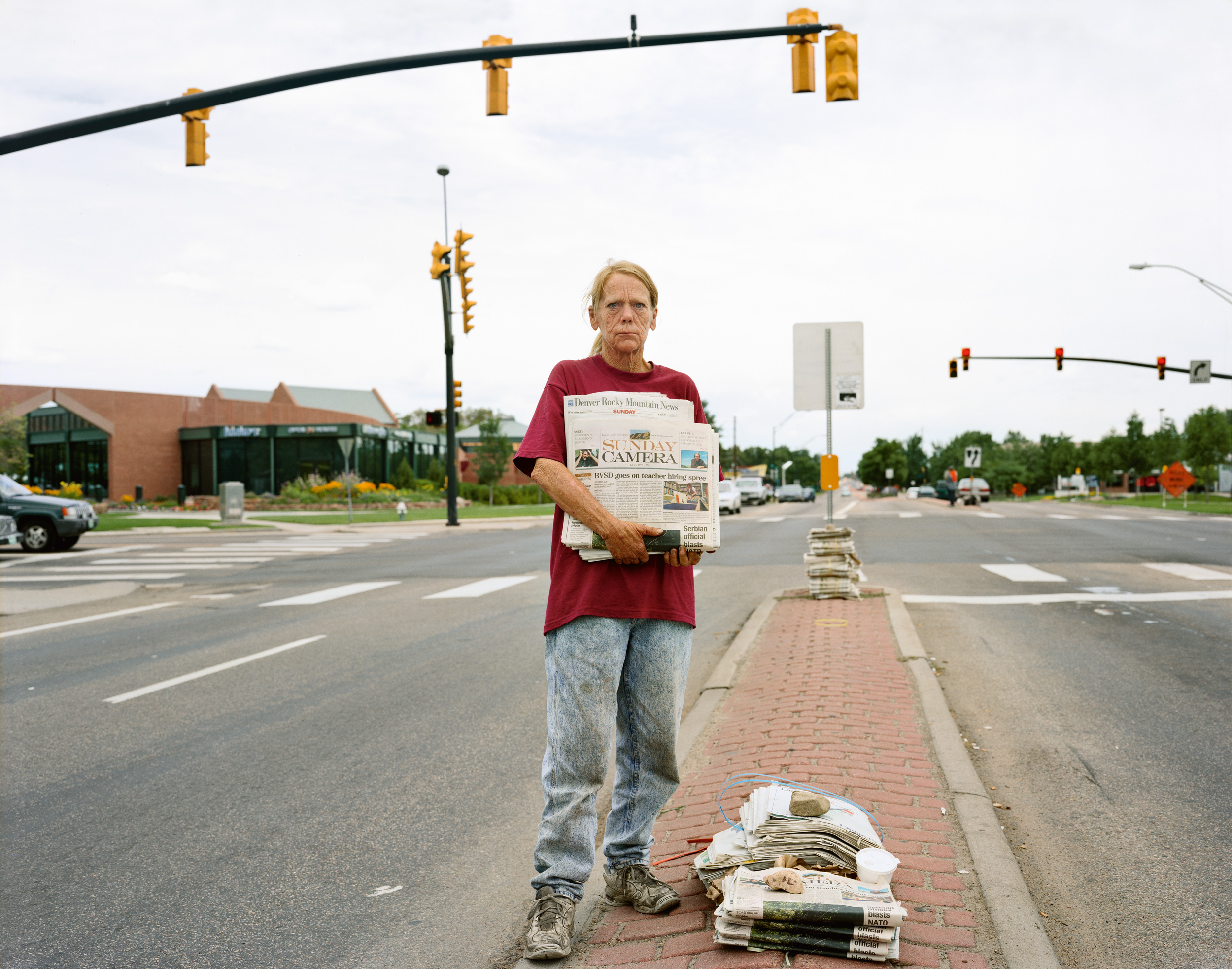A Woman Selling the Sunday Papers, Boulder, Colorado, July 1999