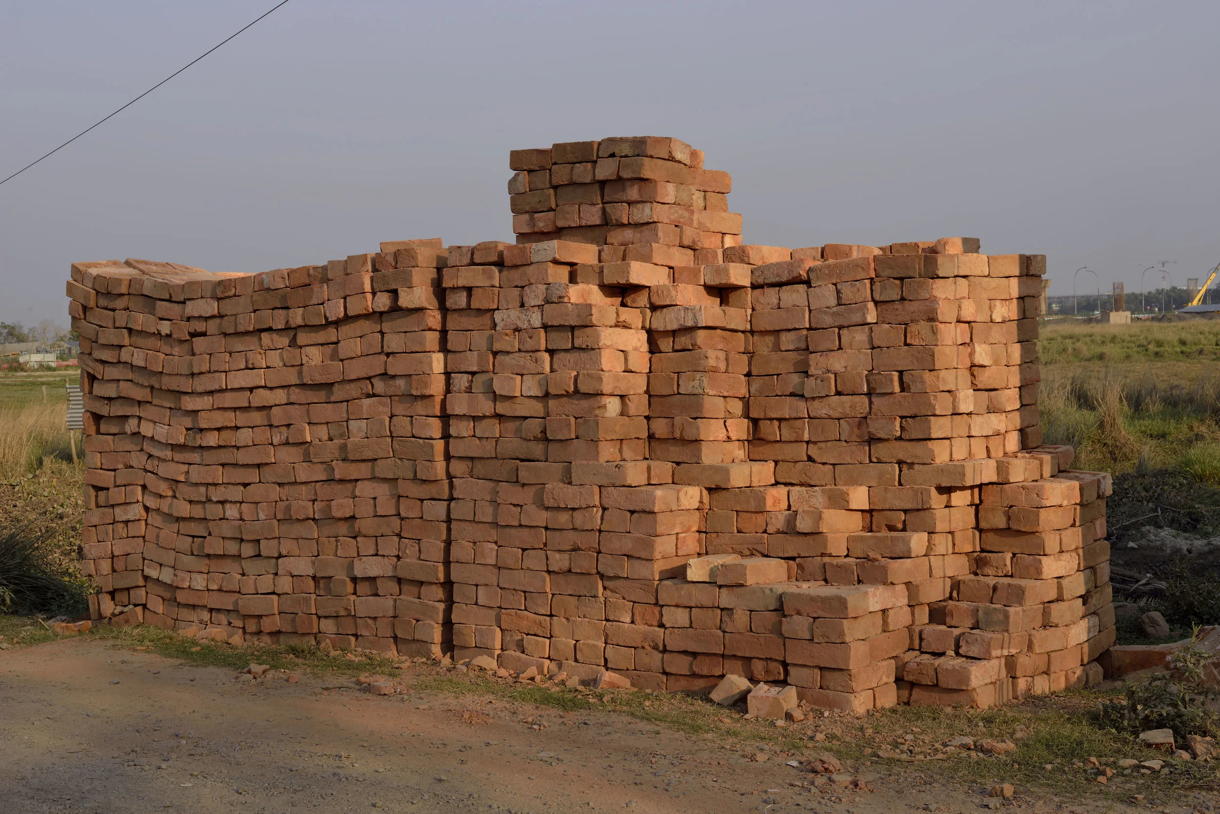 Bricks on the Outskirts of Kolkata, India The use of bricks as a building material goes back at least 9,500 years as confirmed at a site in Tell Aswad in the upper Tigris region of what is now modern Syria. In the Old Testament in Exodus 1:14; 5:4-19 we are told that the Egyptians “came to dread the Israelites and worked them ruthlessly. They made their lives bitter with harsh labor in bricks and mortar.” The organization Union Solidarity International has been campaigning against “blood bricks” in India since 2012. In the words of Andrew Brody, “its modern day slavery. Entire families of men, women, and children are working for a pittance, up to 16 hours a day in terrible conditions. There are horrific abuses of minimum wage rates and health and safety regulations, and it’s often bonded labor, so they can’t escape.”