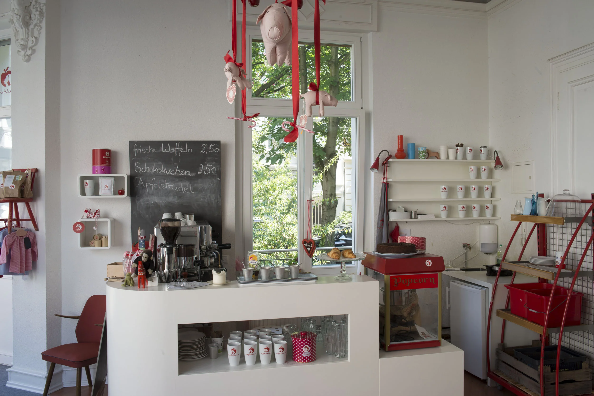 Apfelkind Café, Bonn, Germany This small café, on a leafy residential street in Bonn, Germany, was created with nursing mothers in mind. Apple Corporation sued the café over its use of an apple in it’s logo. Christin Römer, the café owner, refused a settlement which stipulated that she sign a non-disclosure agreement. After a two-year legal battle, Apfelkind prevailed. In human history the apple has come to represent love, beauty, fertility, evil, knowledge, life, health, the world’s largest corporate entity, as well as a simple object of delectation.