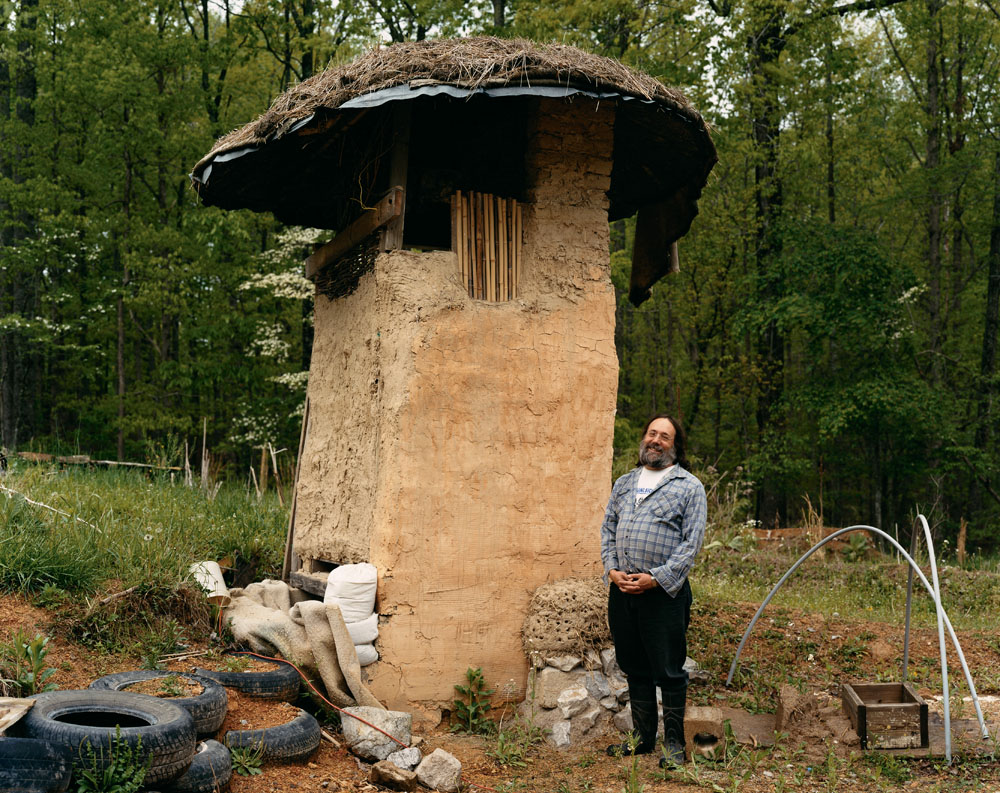 Albert Bates next to a Dry Composting Toilet at the Farm Ecovillage Training Center, Summertown,  Tennessee, April 2005.