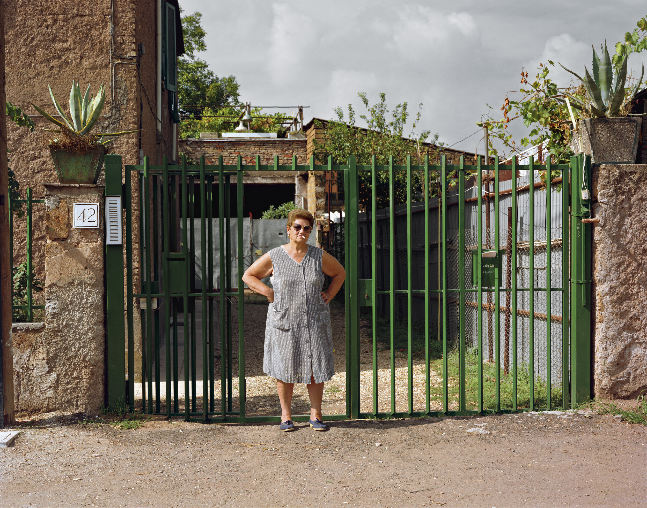 A woman outside her home, Via Appia Nuova, August 1990