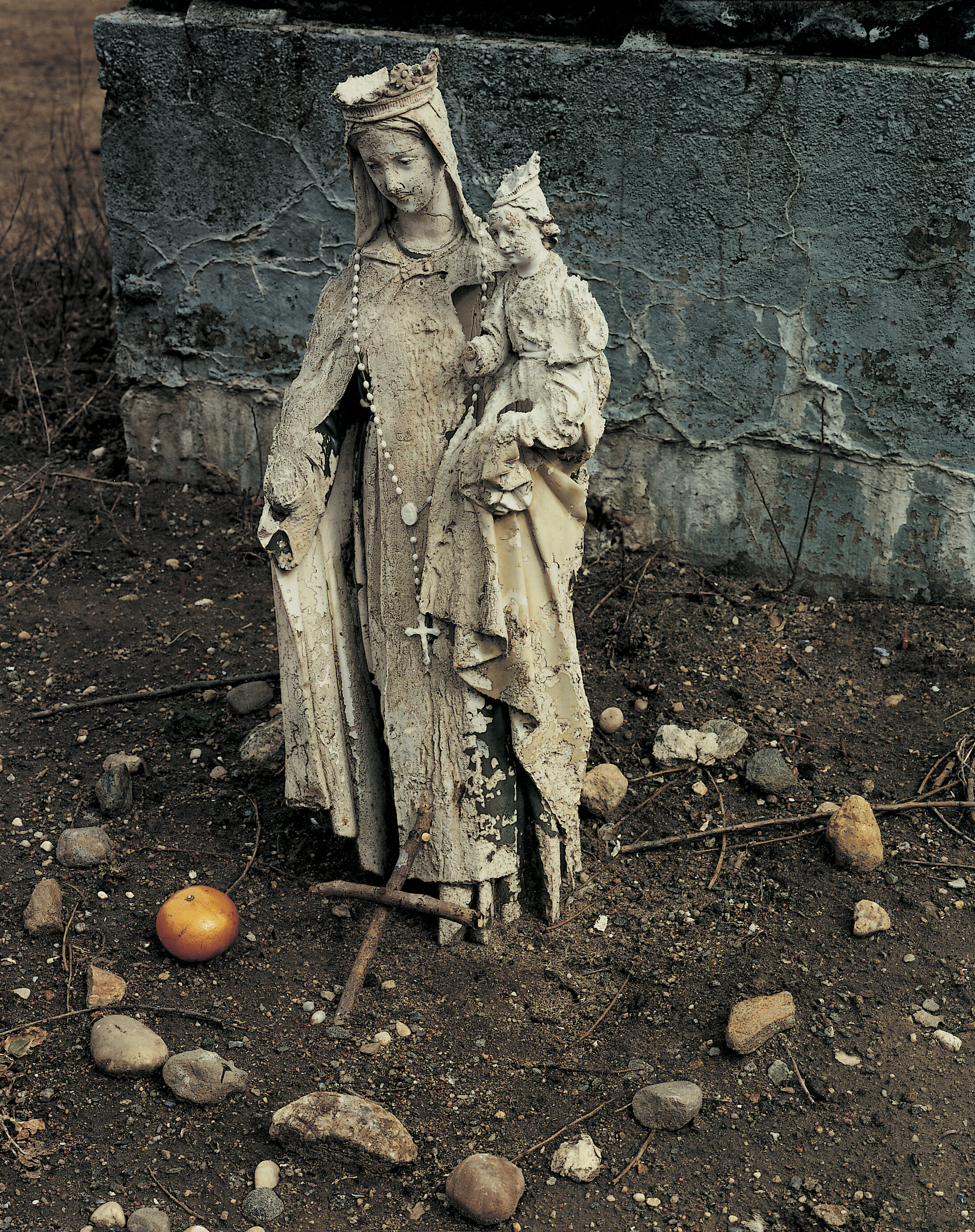 A statue with offerings left by prisoners, December 1991