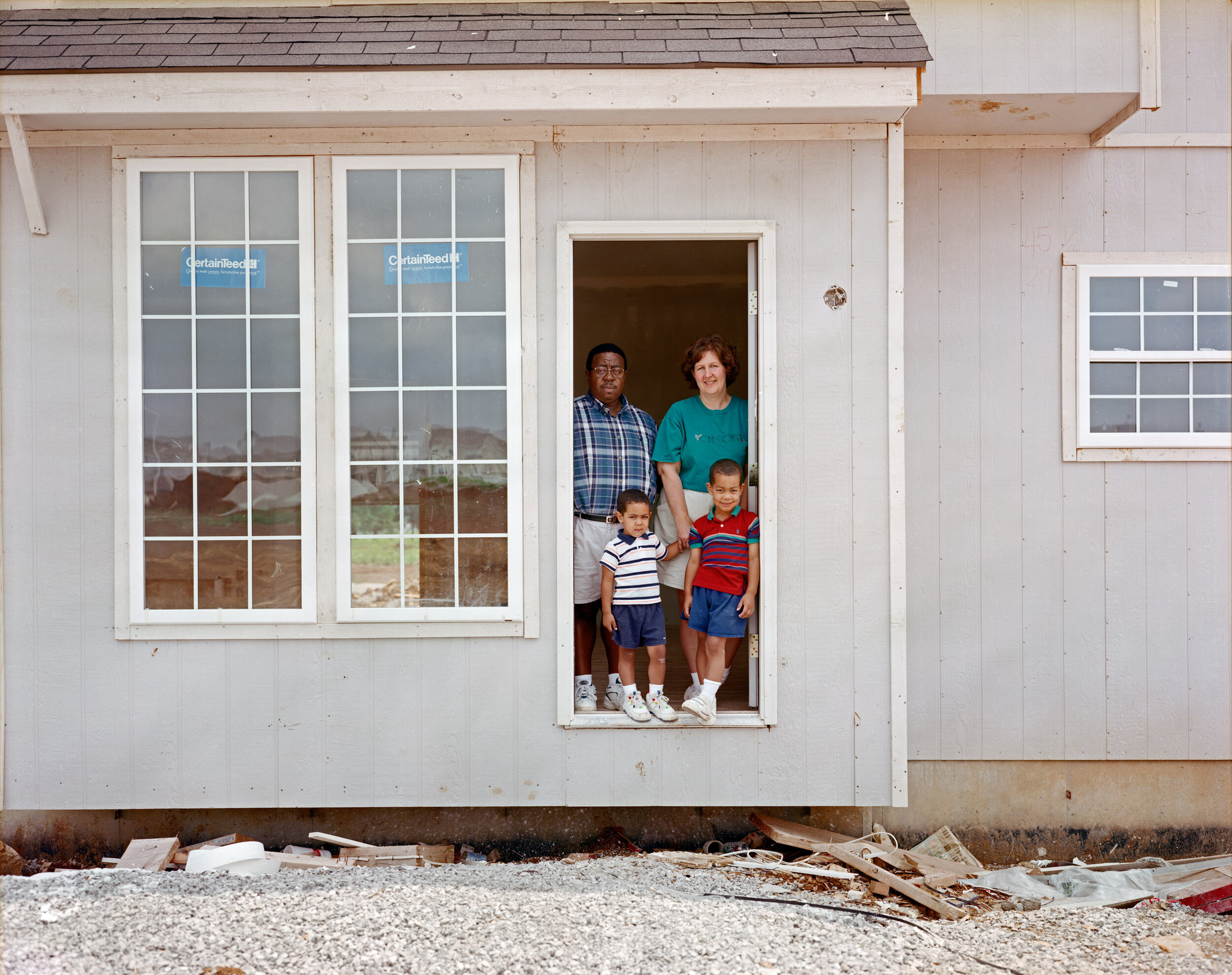 A Family in the Doorway of Their Home during Construction, Lenexa, Kansas, June 1999