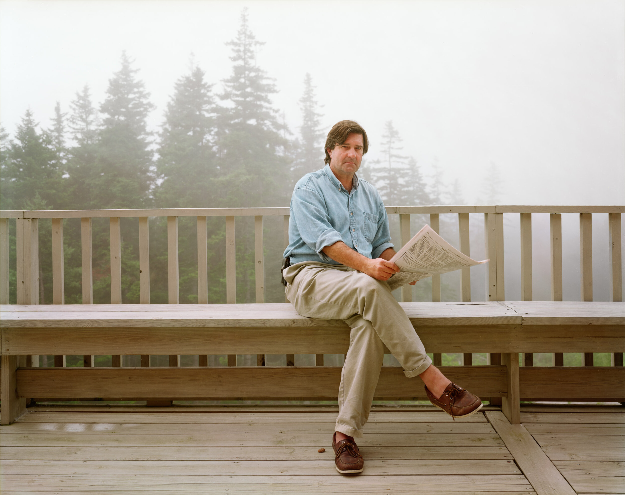 A Man Reading the New York Times while on Vacation in Deer Isle, Maine, August 1996