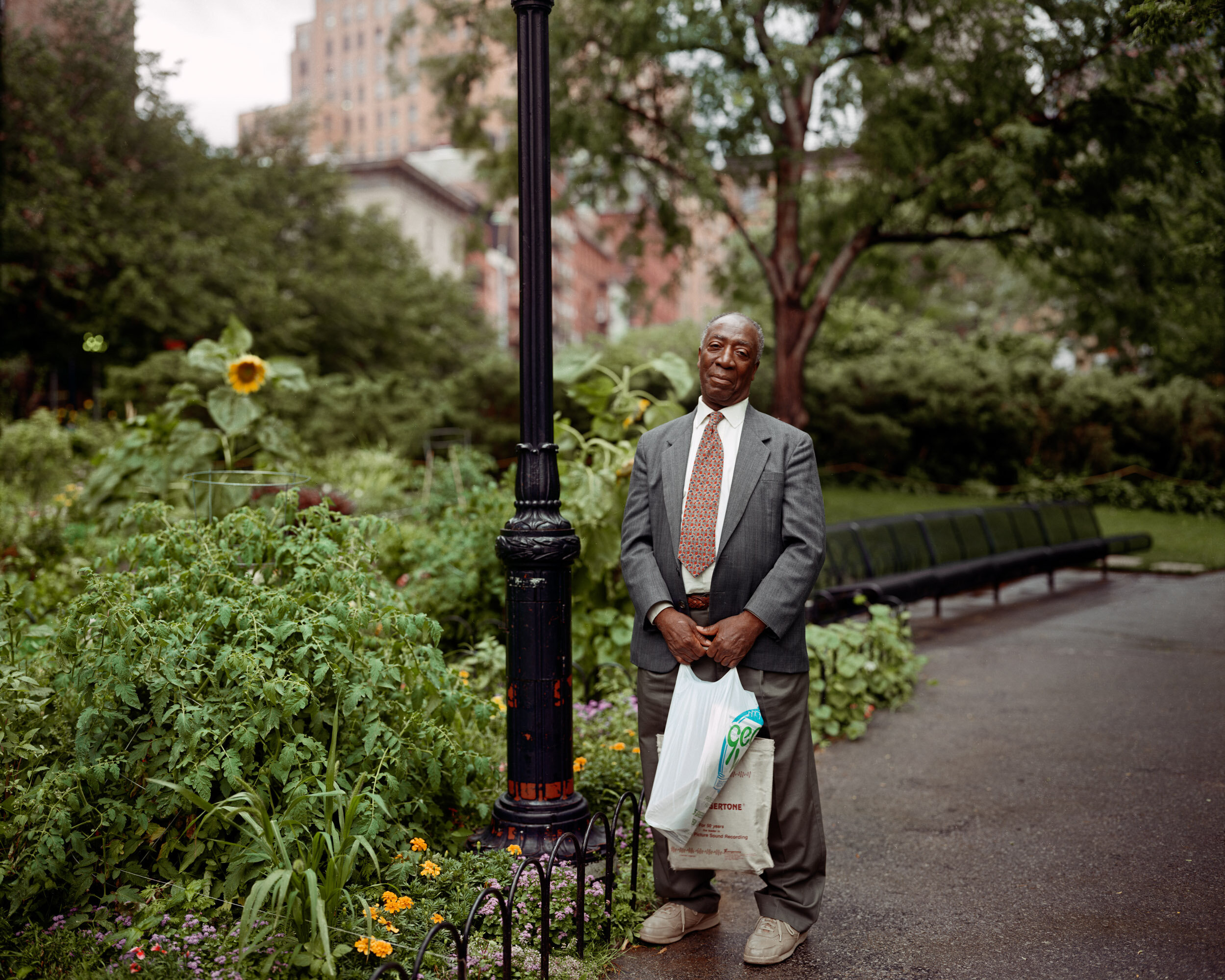 A Man Walking Home through Washington Market Park, New York, New York, August 1997