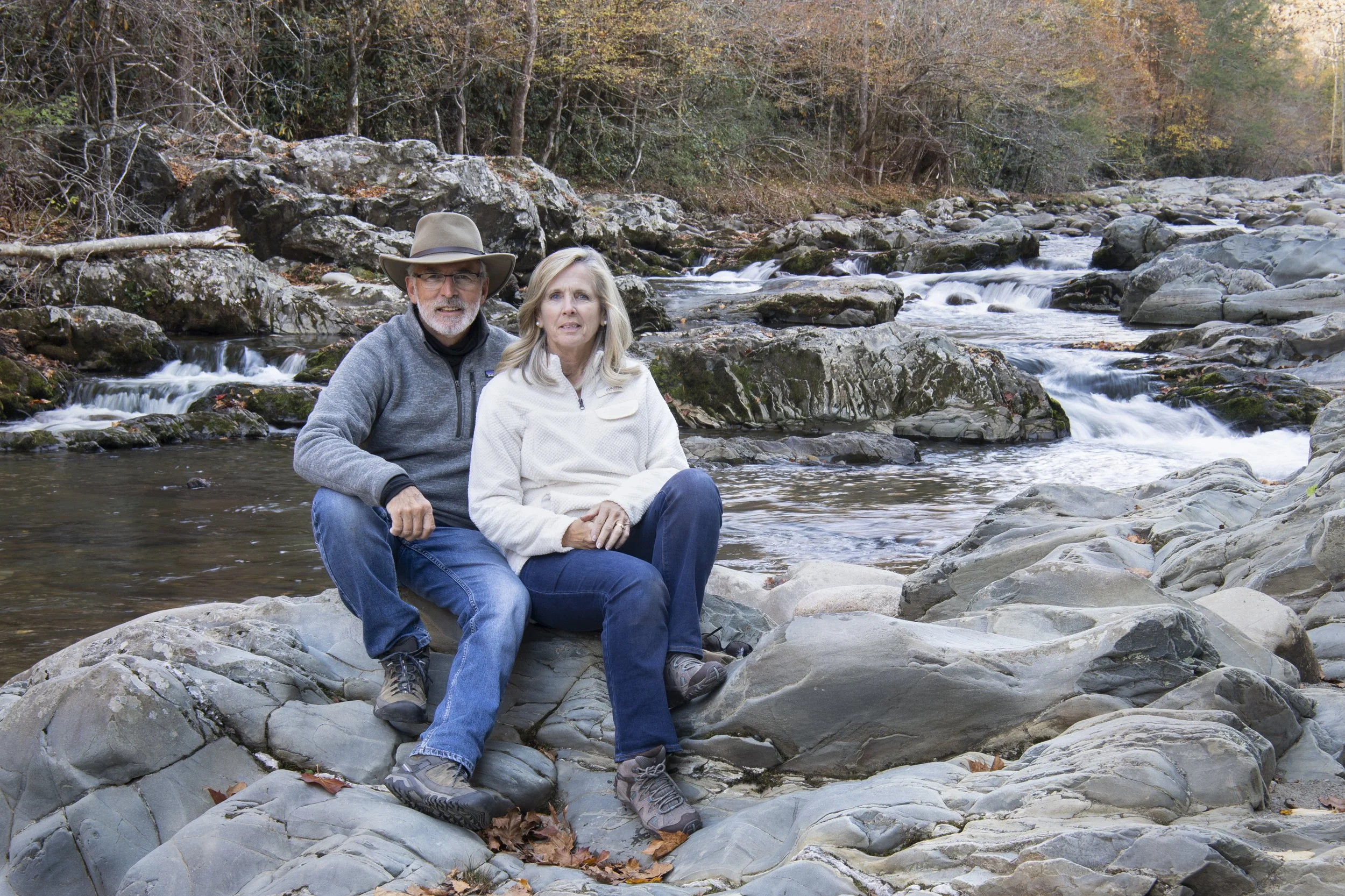 Stan Dunlap and his wife setting by the Little Pigeon river in the smoky Mountains National Park, Tennessee
