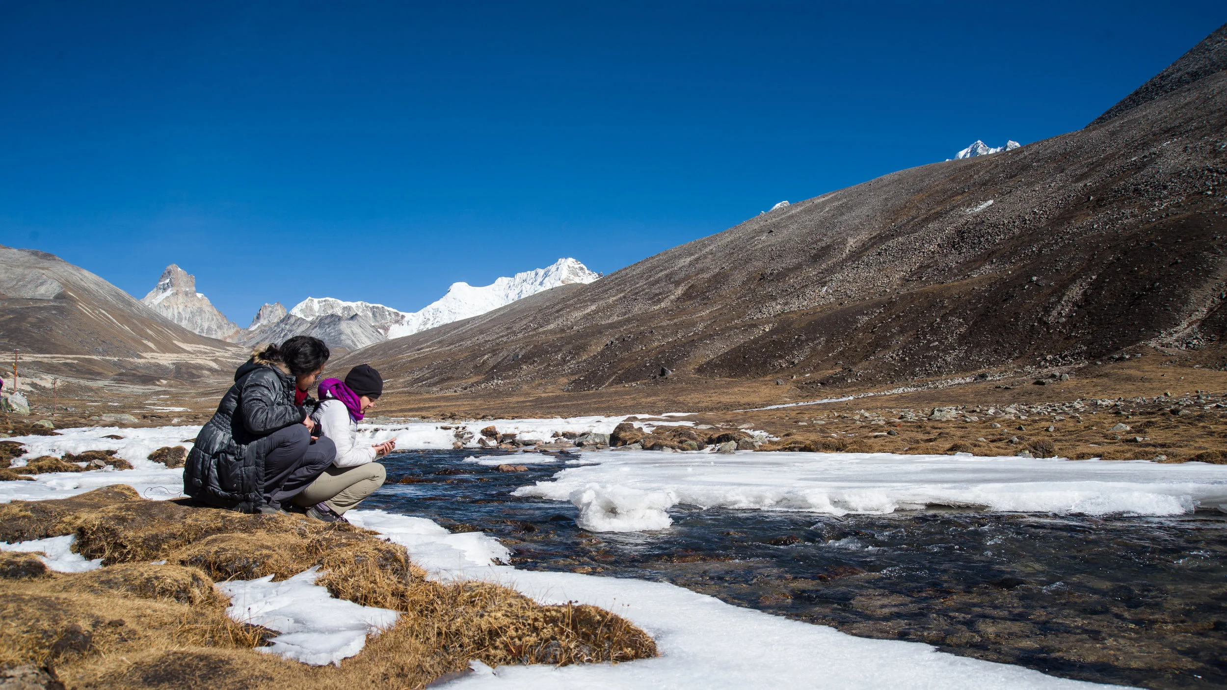 A semi-frozen Lachung river at Yumesamdong Zero Point