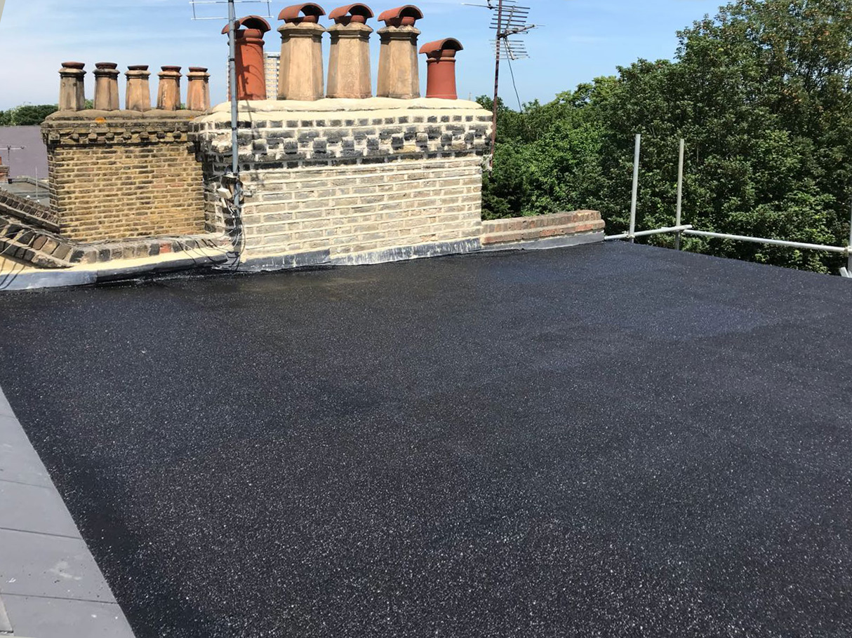  New insulated flat roof with consistant fall and repointed stack. 