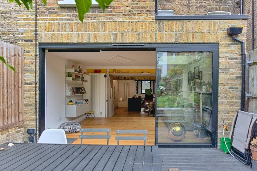 Thin profiled metal framed sliding door to garden.