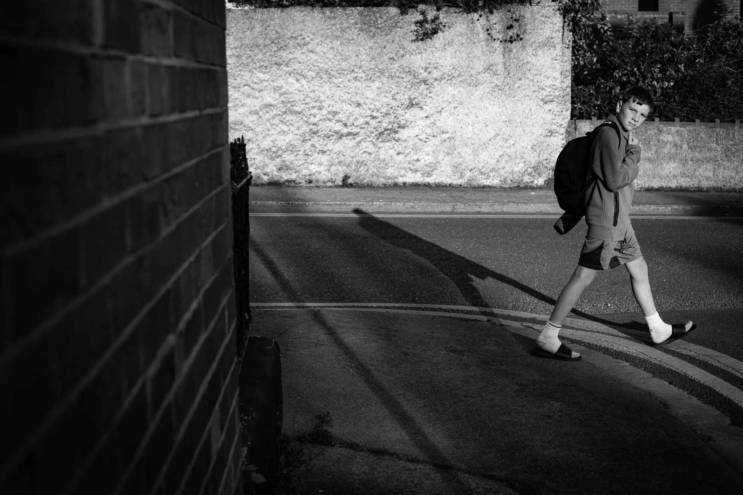 Boy in slippers walks by copy.jpg