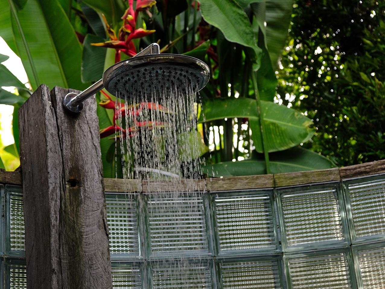 Rainforest shower in semi-open Balinese bathroom