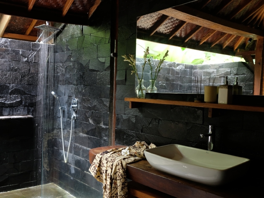 Semi-outdoor bathroom with rainforest shower
