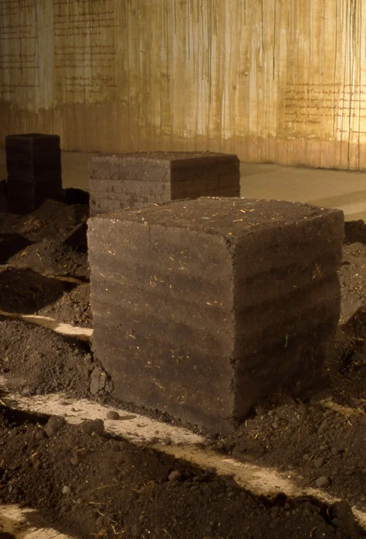 Detail of rammed earth cube and furrows of local topsoil. cube 18 x 22 x 18”.