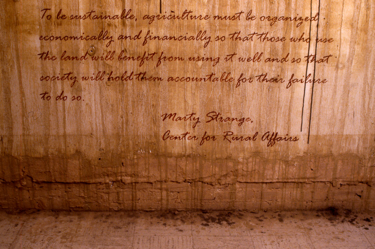  View of walls stained with local pigments and lettered with text from Marty Strange, Center for Rural Affairs. 