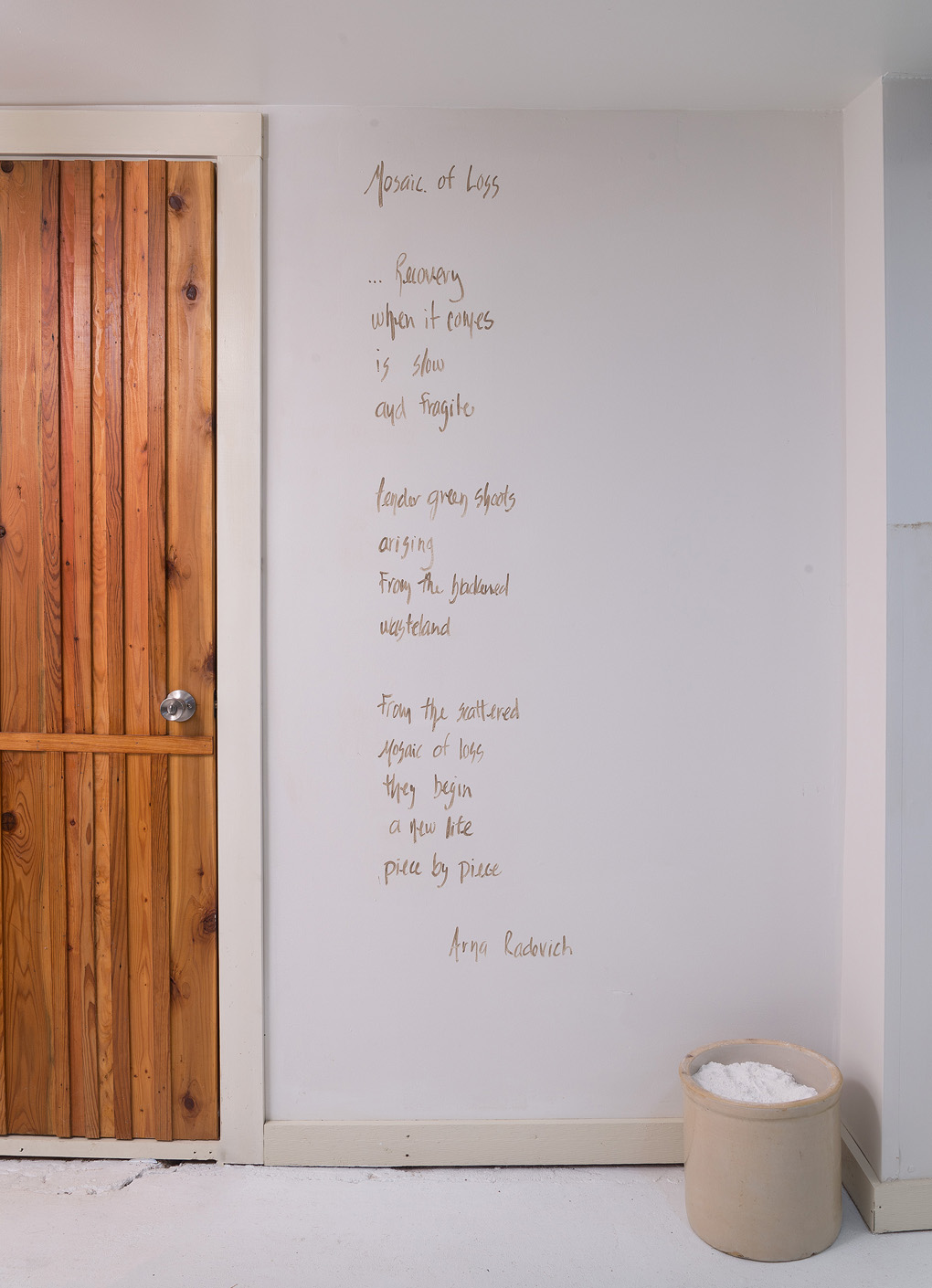  Installation detail of Arna Radovich poem written in Kansas mud. 