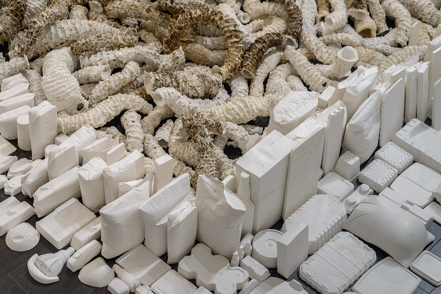   Seemingly Unconnected Events Cubed (V3)  2007- 2014 (ongoing)  DETAIL, Hundreds of plaster casts of organic forms interwoven and interconnected with consumer goods casts, 4 x 4 x 40” highest point  Installation at Epsten Gallery, Village Shalom, me