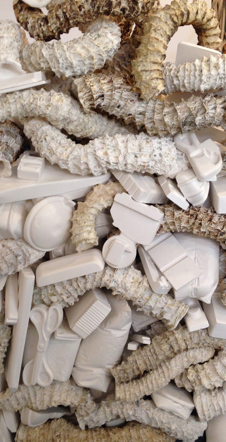   Seemingly Unconnected Events: The Wedge &nbsp; 2007- 2015  Hundreds of plaster casts of organic forms interwoven and interconnected with consumer goods casts*, 90 x 30 x 45”.&nbsp;  Installation at H&amp;R Block Artspace, Kansas City, MO, Fall 2015