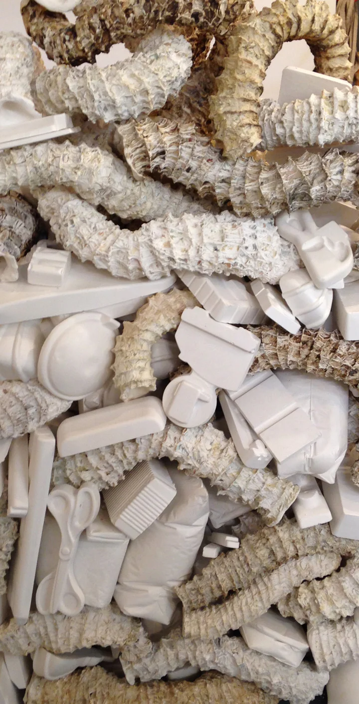 Seemingly Unconnected Events: The Wedge 2007- 2015 Hundreds of plaster casts of organic forms interwoven and interconnected with consumer goods casts*, 90 x 30 x 45”. Installation at H&R Block Artspace, Kansas City, MO, Fall 2015.
Photo: E.G. Schempf