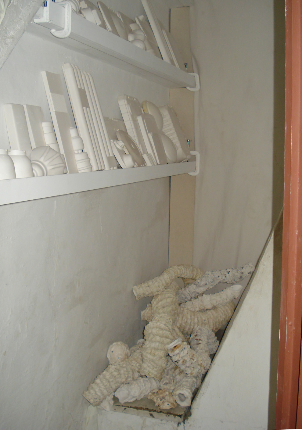   Seemingly Unconnected Events: Storage  2011 Wentworth-Coolidge State Historic Mansion Portsmouth, NH  Installation in closet with consumer goods casts separated from “seaworm” habitat casings casts.  Plaster casts of organic forms with casts into c