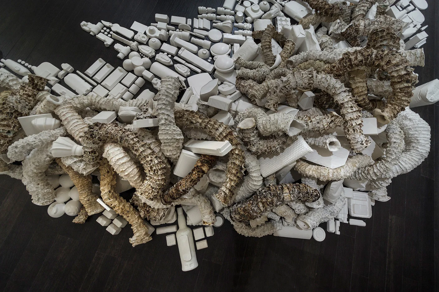 Seemingly Unconnected Events V4 2007- 2014 (ongoing) DETAIL.Hundreds of plaster casts of organic forms stacked and interlaced with consumer goods casts, 15 x 7 x 2.5’ Installation for Re Imagine, Three Person Exhibition, Epsten Gallery, Village Shalom, metropolitan Kansas City, 2014
Photo: E.G. Schempf