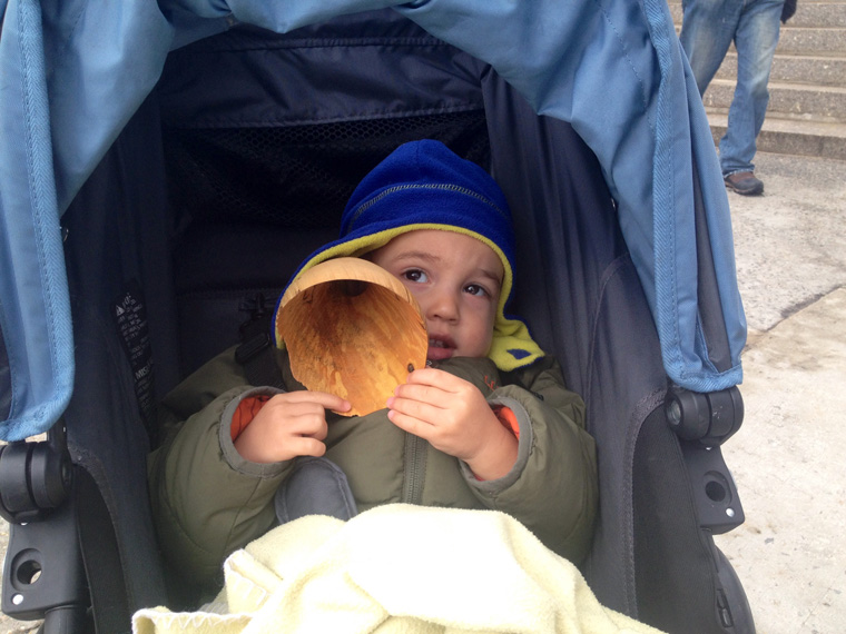  The youngest listener in the North Woods, Sound and Sight Walk, Central Park, New York City, March 8, 2015. Ten handcarved wooden burl ear trumpets used by participants. Walk planned and led by Karen McCoy by invitation of the Walk Exchange, NY. (ph