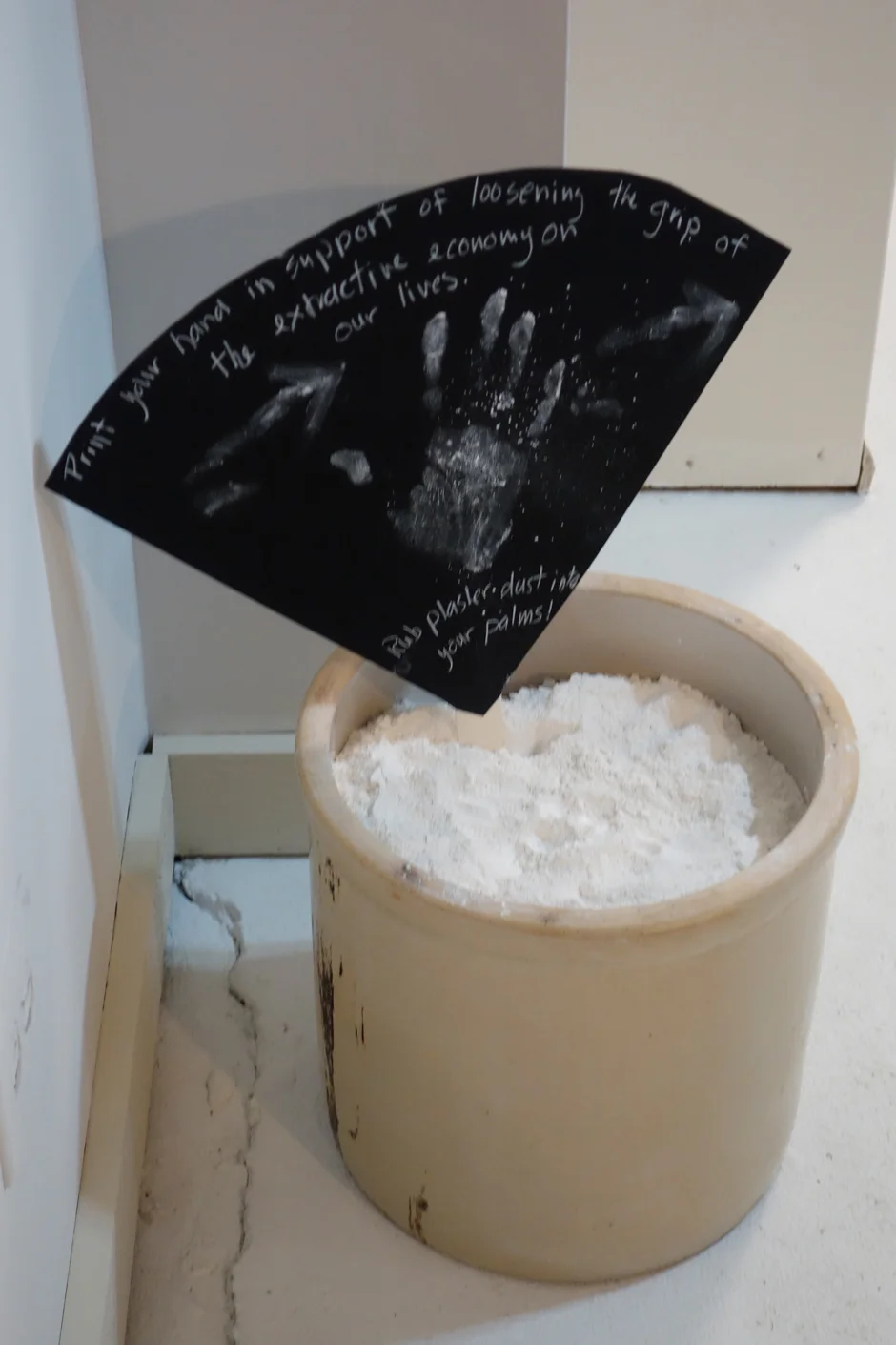 Installation detail of plaster dust for handprints.