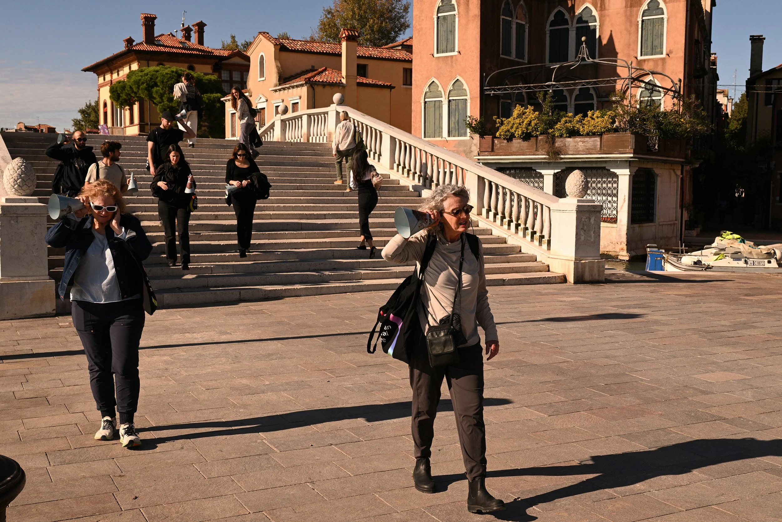 Trying the horns for listening at the Giardini Vaporetto Pavillion