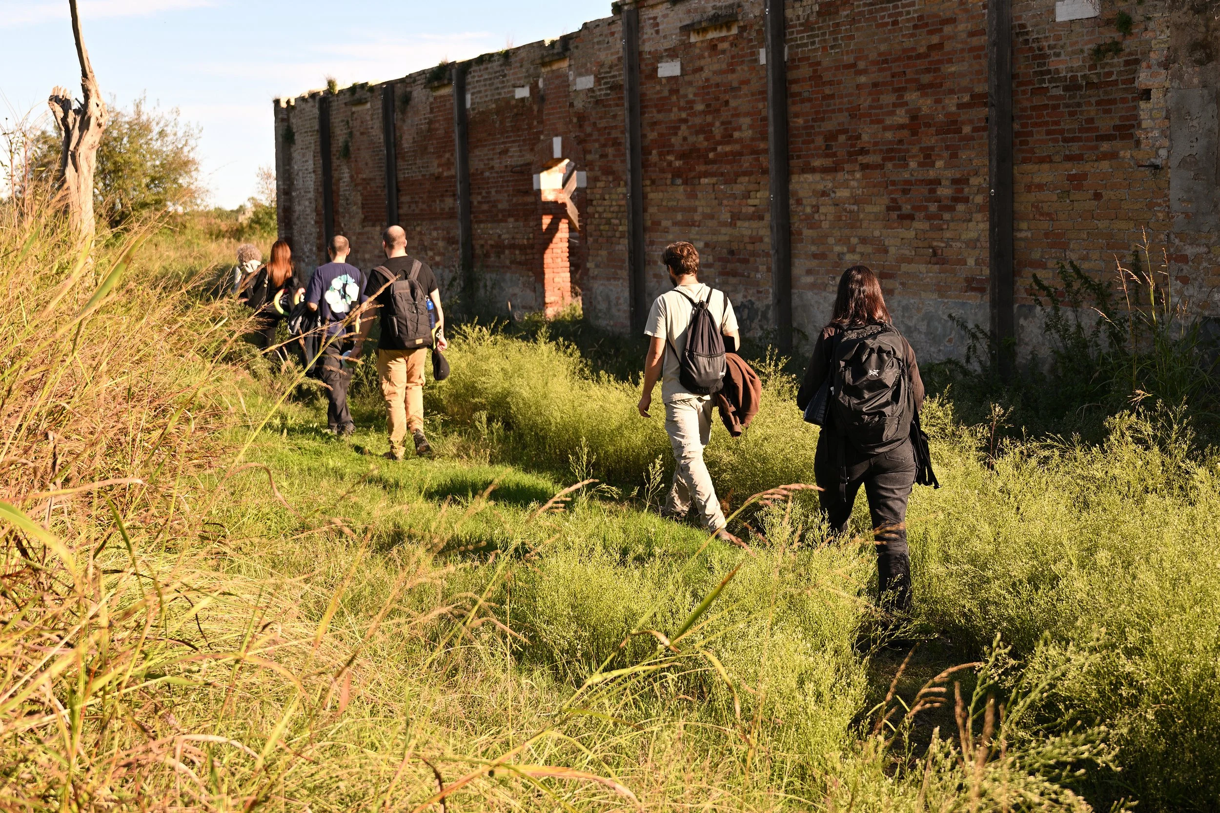 Walking towards entry to an abandoned structure