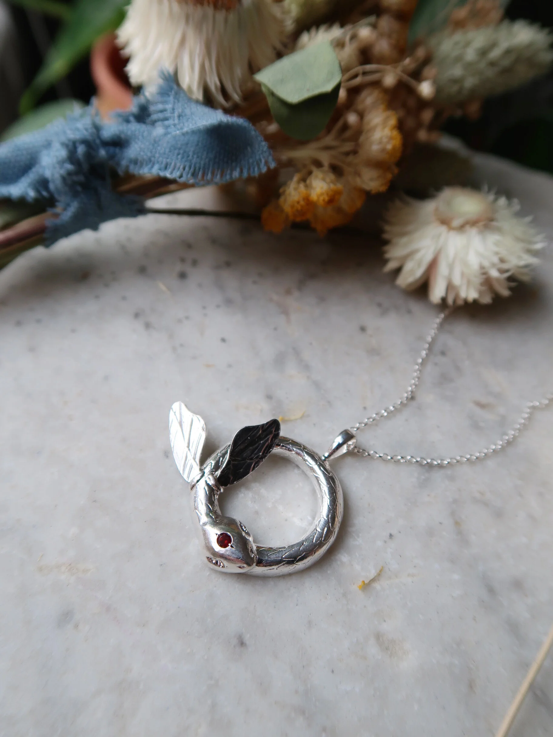 Winged Ouroboros Pendant - Sterling Silver with Garnet - $300.00