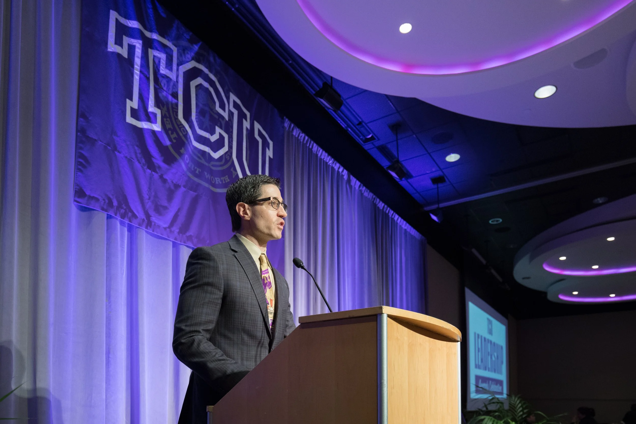 Carlo Capua speaking at a live event