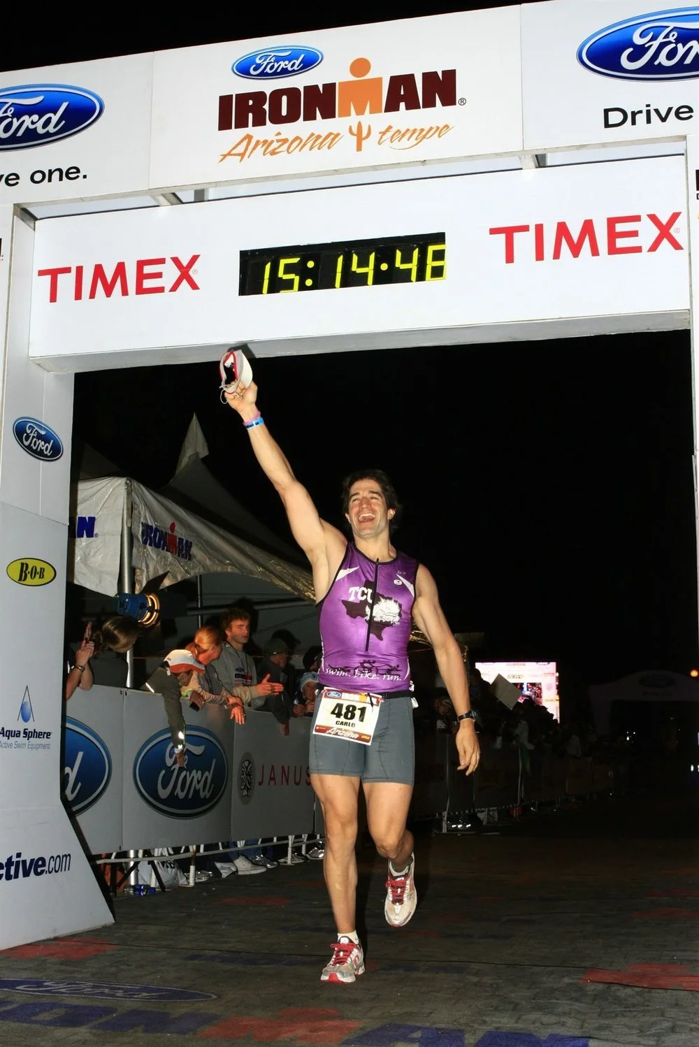 Carlo Capua crossing the finish line at an Ironman Triathlon
