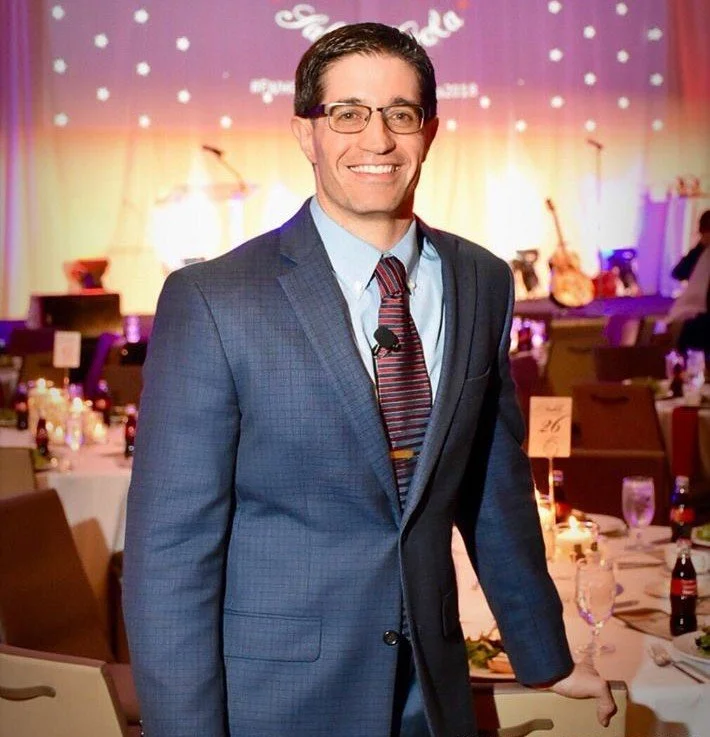 Carlo Capua hosting a formal gala