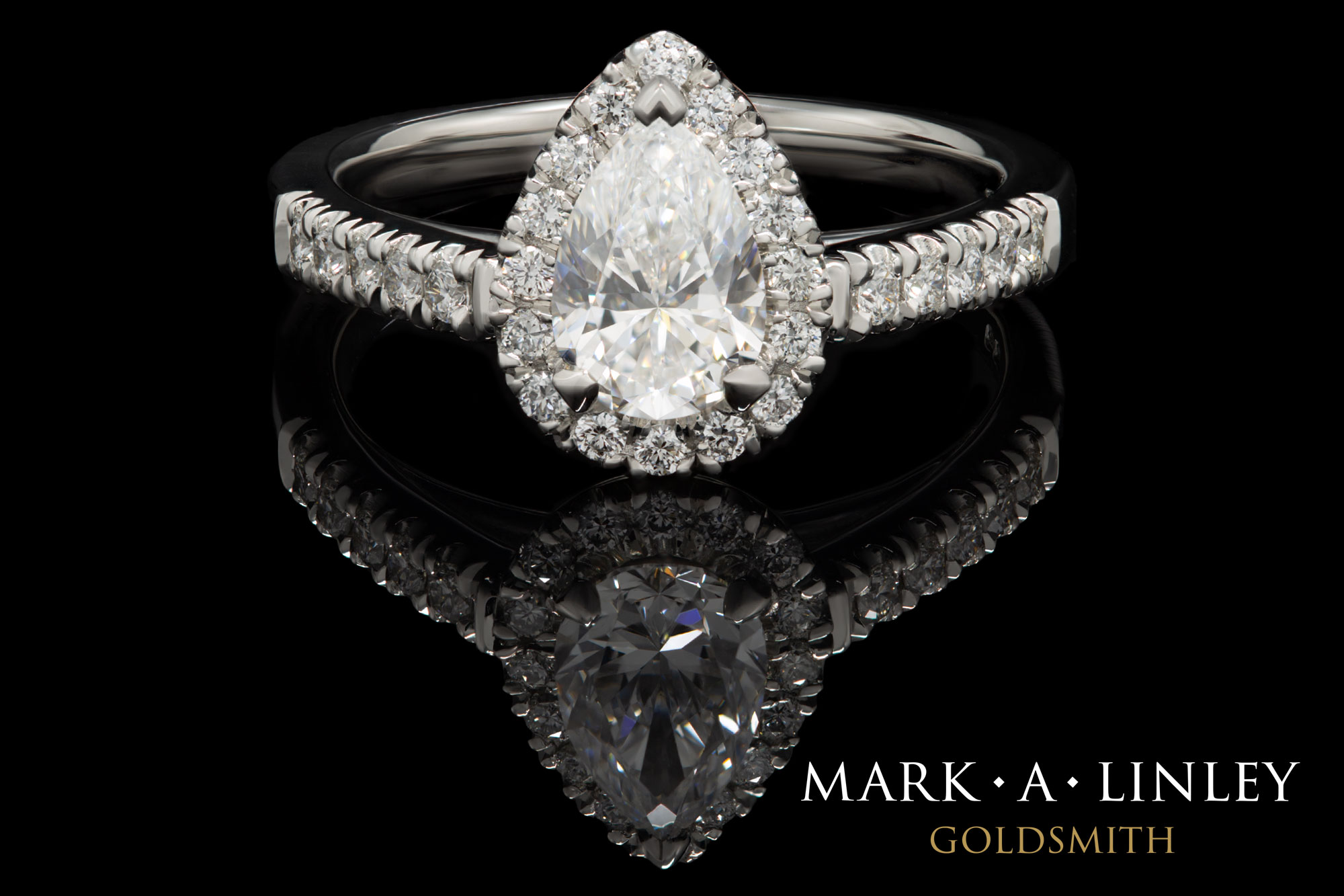 Platinum pear-shape halo diamond ring