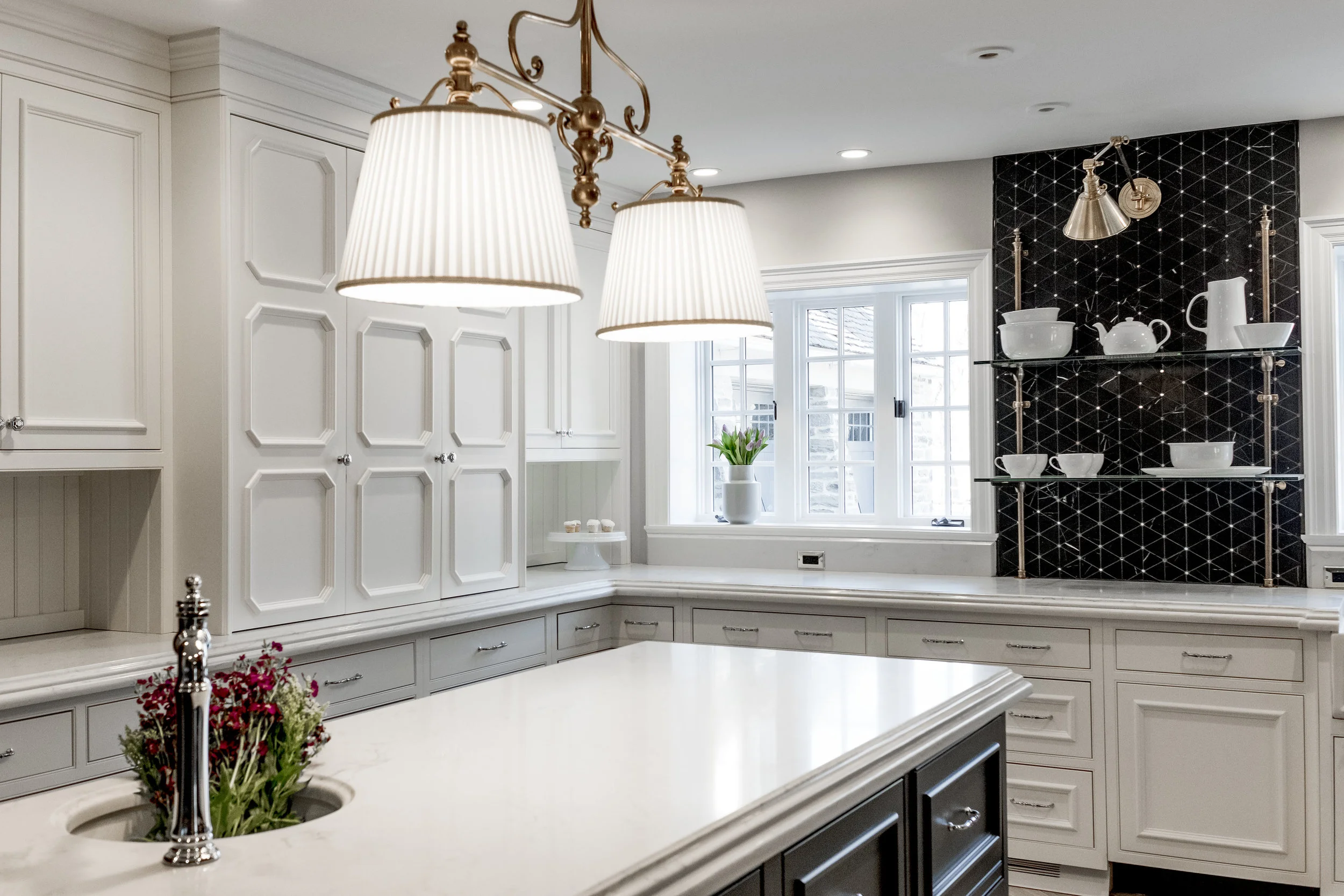 French country kitchen with quartz countertops and white cabinets