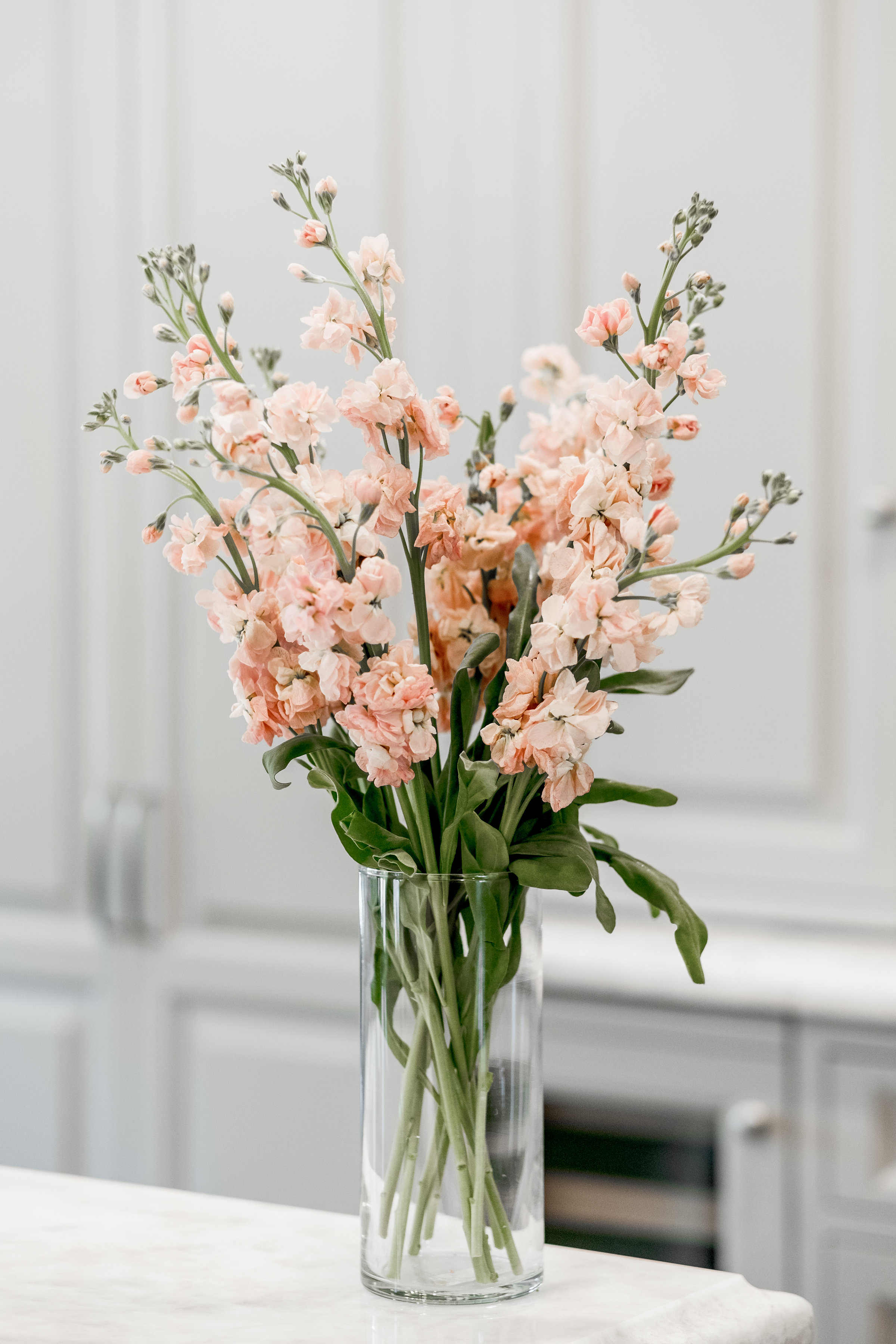 Custom cabinets with fresh flowers in vase
