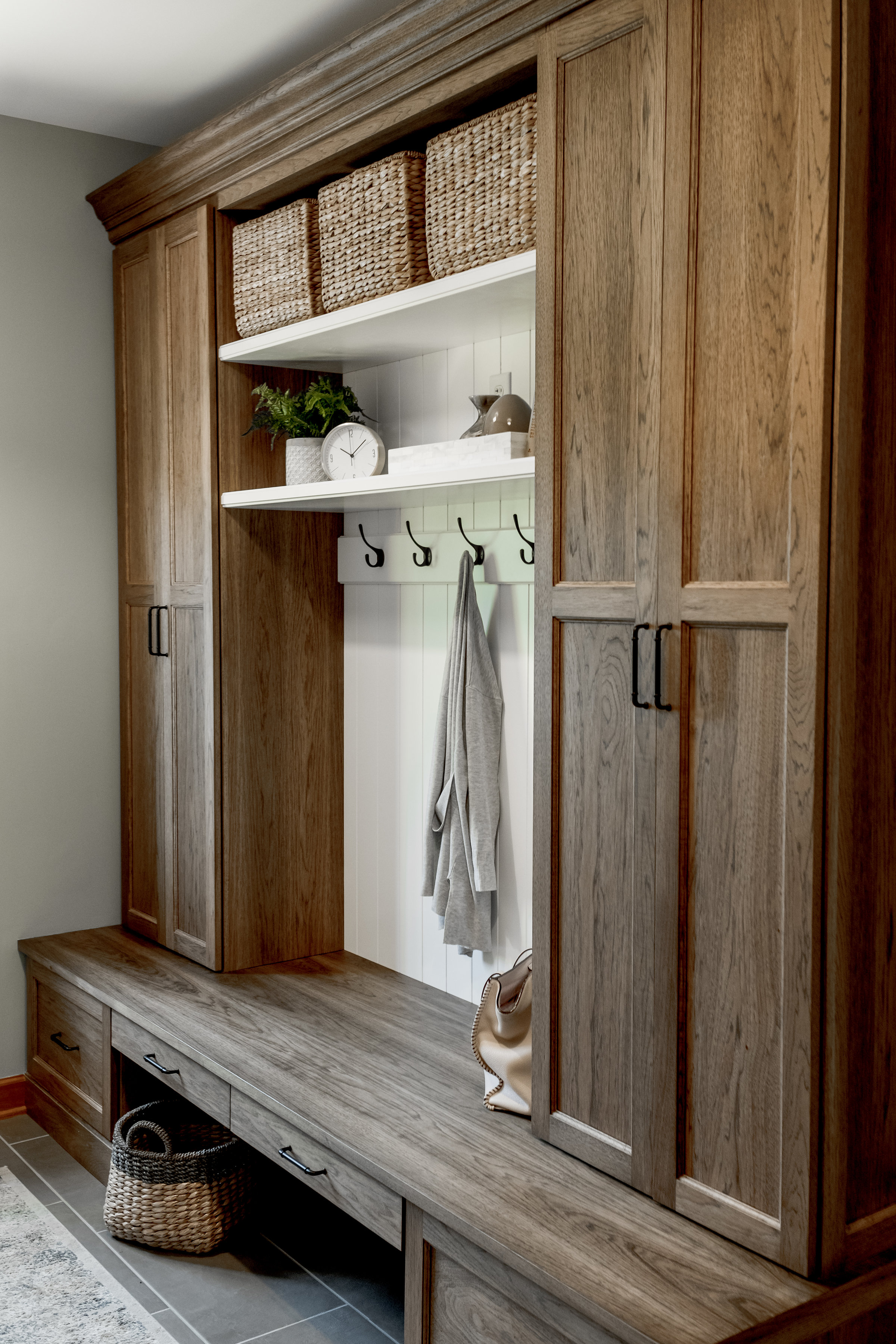 Custom wood locker and cabinet system in mudroom