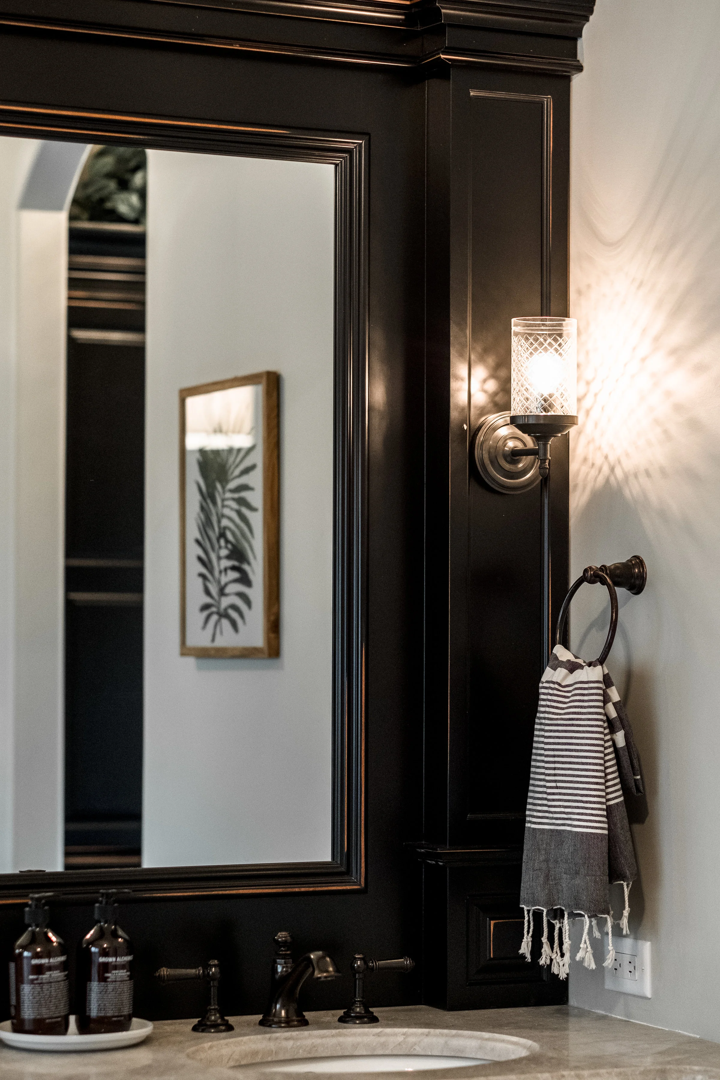 Dark wood custom cabinets in master bath